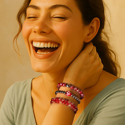 NOGU August’s Color Palette stack of red, pink and black beaded bracelets, styled for bold summer color.