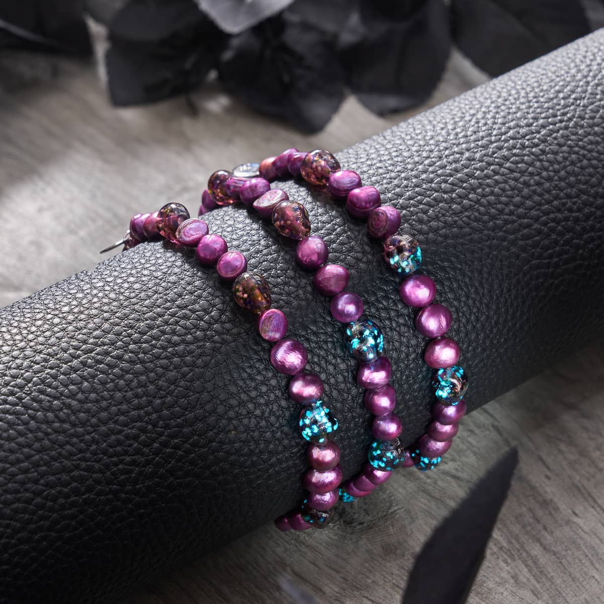 Violet Shadows bracelet features radiant purple freshwater pearls and glowing firefly glass skull beads on .925 sterling silver by NOGU