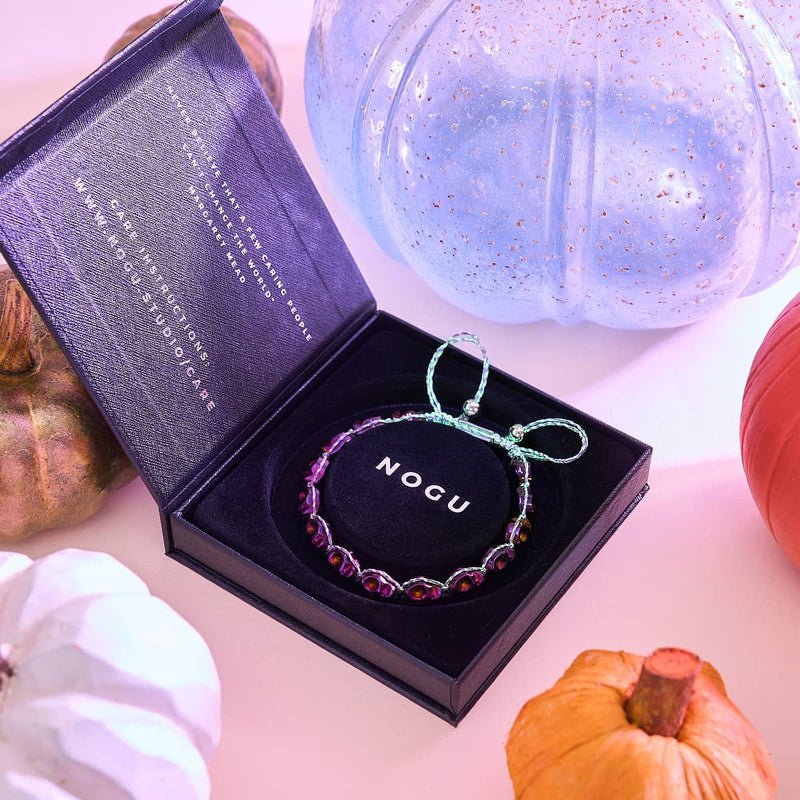 Nyx | Purple Hematite Skulls x Violet GloWeave | Macrame Bracelet