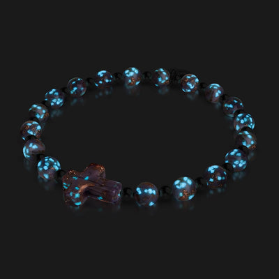 Periwinkle Firefly Glass Cross Bracelet with glowing blue phosphorescent beads and silver finish by NOGU
