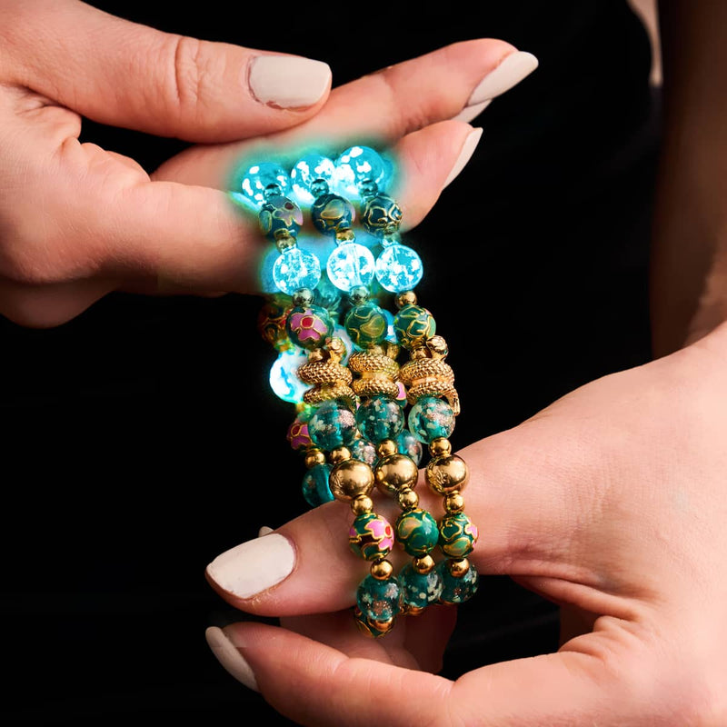 Bracelet serpent en verre bleu sarcelle et motif luciole, dragon de mer, lotus en émail