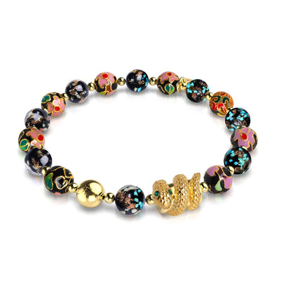 Shadow Dragon enamel lotus and onyx Firefly glass bead bracelet with 18k gold-plated serpent charm by NOGU