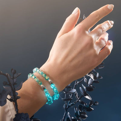 Aurora Spark double Firework Glass bead bracelet with turquoise and gold flecks on wrist with .925 sterling silver clasp by NOGU