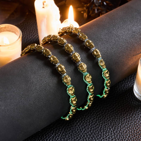 Tombeau de Midas | Crânes d'or x GloWeave noir | Bracelet en macramé
