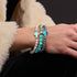 St. Ambrosia | Bracelet croix en argent sterling 925 avec perles d'eau douce holographiques et verre Firefly turquoise