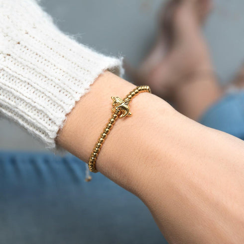 Pégase | Or 18 carats | Bracelet à breloques en macramé licorne ailée