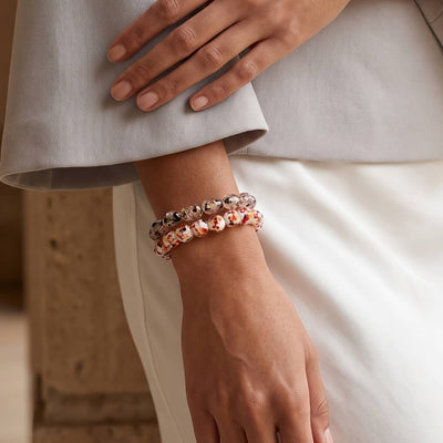 NOGU Vampire’s Kiss ’26 stacked beaded bracelets with white, red and copper Firefly Glass accents.