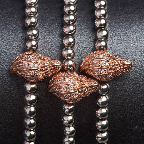 île | Or rose 18 carats et argent | Bracelet à breloques en coquille de conque en cristal 