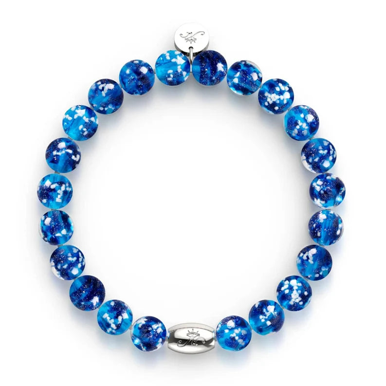 NOGU Firefly Glass bracelet with vivid cobalt and turquoise blue round beads, white flecks, and sterling silver accents.