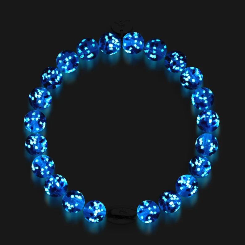 NOGU Firefly Glass bracelet with vivid cobalt and turquoise blue round beads, white flecks, and sterling silver accents.