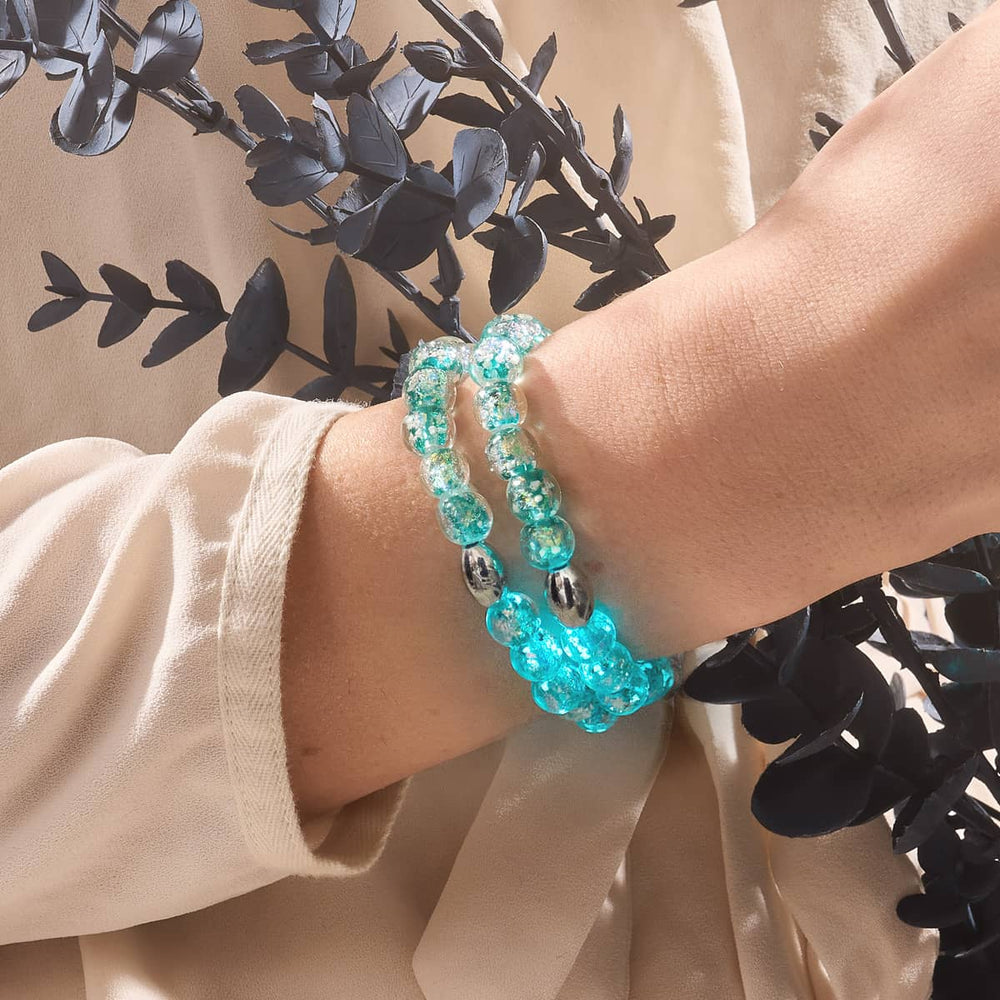 Aurora Spark double Firework Glass bead bracelet with turquoise and gold flecks worn on wrist with .925 sterling silver clasp by NOGU