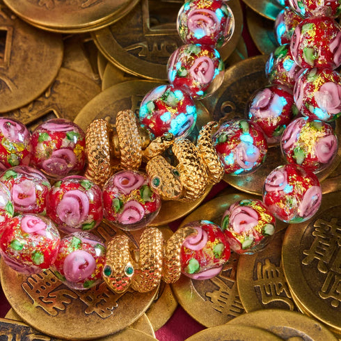 Bracelet serpent doré | Rose en verre avec feu d'artifice