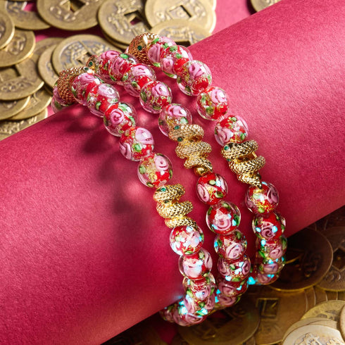 Bracelet serpent doré | Rose en verre avec feu d'artifice