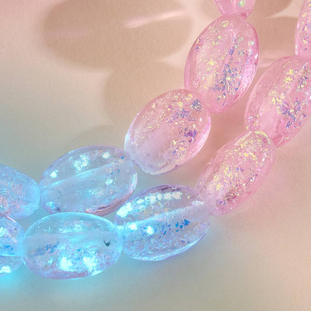 Pink Pony Club bracelet close-up with pink and blue iridescent Firework Glass pebbles showcasing glittery texture by NOGU