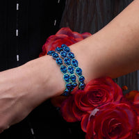 A close-up of a skull bracelet that glows in the dark, adding a spooky touch to any Halloween costume.