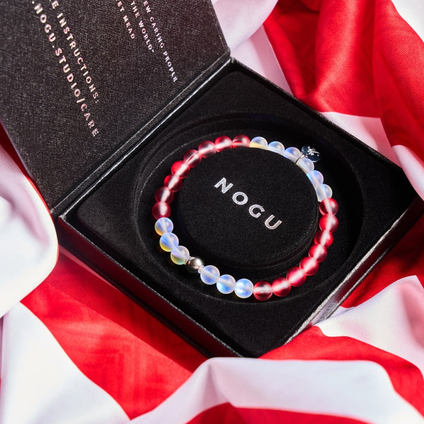 Canada Mermaid Glass Nations Bracelet with 6mm iridescent red and white beads and silver charm in black gift box on Canadian flag by NOGU