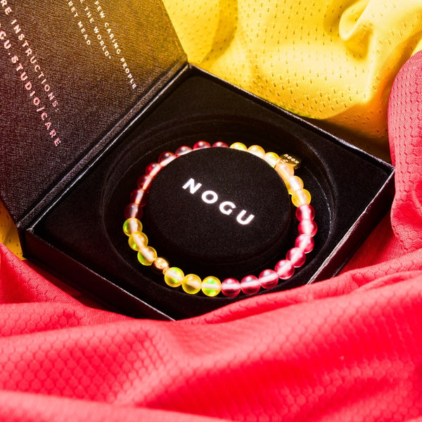 SPAIN Mermaid Glass Nations Bracelet with 6mm iridescent beads and gold-finished stainless steel charm in black NOGU box